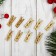 A set of decorative clothespins in dark gold, 50 pcs.