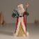 Polystone souvenir "Santa Claus in a red fur coat, with a staff, with a gift" 11.5x8.5x20.5 cm