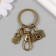 Browler Metal with carbine "camera and girl" bronze 6.2 cm