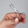 Pinzet in the form of scissors, curved, 8 cm, silver color