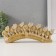Polystone souvenir "Seven white elephants in golden blankets on a carved tusk" 11x3.5x28.5 cm