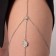 Erotic accessory on the thigh, silver