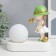 Souvenir Polystone Light "Baby in a green hat, with a gold bubble at the ball" 16.5x8x16 cm