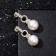Earrings with pearls "Balls and clutch of rings", white color in silver