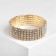 Bracelet with rhinestones "ice" 5 rows, white color in gold, d = 7.5 cm