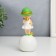 Souvenir Polystone "Baby in a green hat, with a gold bubble on the ball" 16x7x7 cm