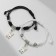 Bracelets "Demetrons" rabbits with bows, black and white color, 7 cm