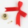 A bell on a pin with a bow for graduation, red, d = 2.6 cm