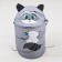 A basket for storing Raccoon toys with handles and a lid