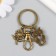 Trick Metal with carbine "Eagle and Flower" Bronze 6 cm