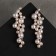 Earrings with pearls "jasmine" branch with pearls, white color in gold