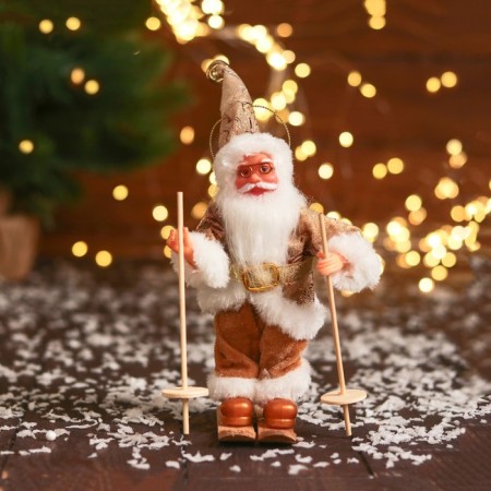Santa Claus "in a brilliant suit, skiing" 16 cm, golden white