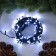 Garland “thread” 10 m, IP44, UMS, dark thread, 100 LED, white glow, flickering all LEDs, 24 V