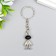 Metal keychain "Cosmonaut with black helmet" silver 2.9x1.5x0.5 cm