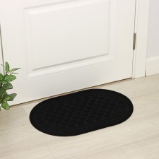 The rug is a groomed moisture -drinking “scales”, 40 × 60 cm, black color