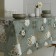 Camelia oilcloth 140 cm, roll 20 m, white drawing, green peony