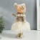 Interior doll "Baby in a beige outfit, a skirt from a mesh" 33x15x18.5 cm