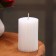 Candle-cylinder with faces, 5x7.5 cm, pearl, 6 hours