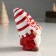 Polystone souvenir "Santa Claus in a white cap in red striped, with a candy" 9x6.5x10 cm