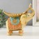 Polystone souvenir "Beige elephant with a gold leaf on the back" 19.3x11x19 cm
