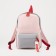 A backpack with a zipper, the color is pink