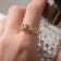 The ring "melting" is stuffed, the color is white in gold, dimensionless