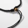 The pendant on the unisex cord is hematite, the length is regulated, 35 cm