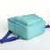 A backpack with a zipper, an outer pocket, the color is turquoise