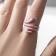 Ring "Snake" in polka dots, pink color in silver, dimensionless