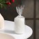 Candle-cylinder with faces, 5x7.5 cm, white, 6 hours