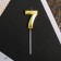 Candle for the cake, the number "7", gold.