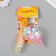 A plastic keychain with a carbine, a strap "Ice Cream Horn" Water with decor1.8x5.3x5.6 cm