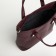 Bag-tout, 2 parts on zippers, external pocket, long belt, burgundy color