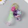 A keychain plastic with a carbine, a strap of "balloon" water with colors 4.5x4.5x7 cm