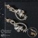 Earrings with “evening” rhinestones, rounded, white color in gold