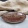 Plant of Rishtan ceramics "Patterns", brown, flat, 15 cm