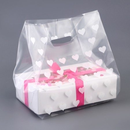 Polyethylene square package with a cut handle, packaging, "hearts", 25x35+16cm ± 5% 60 μm-1