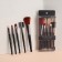 A set of makeup brushes, 5 objects, black/pink gold color