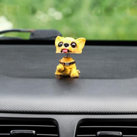 Dog on a car panel shocking his head, mini, spaniel-2