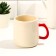 Ceramic mug with a lid and a spoon “Listen to Heart”, 450 ml, beige color