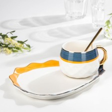 Tea couple ceramic with a spoon 
