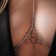 Erotic accessory on the chest, silver