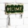 The keyrean is wall -mounted with moss "Home".