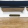 The ship souvenir medium "Kalev", the sides are blue with a white strip, the sails are blue, 30x7x32 cm