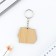 A wooden key key "is not such", 5 x 4.2 cm