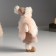 Interior doll "Baby in a fur vest and in a hat with a pompom" 27x9x12 cm