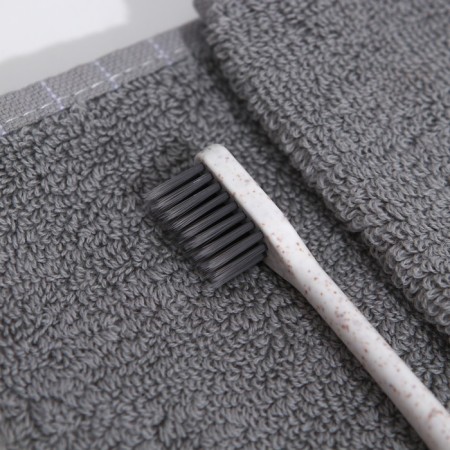 The toothbrush is soft, in the tube, white-2