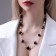Beads with pearls "gallantry", black and white color in gold, 80 cm