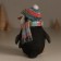 Polystone souvenir "An angry penguin in a hat with a bomb, in a colored scarf" 9.5x9.5x12.5 cm