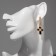 Earrings with rhinestones “crosses” chain, white-black color in gold